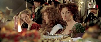 Movie still from “Vatel” (2000), directed by Roland Joffé – A group of people sitting around a table; Close Up shot, Over the shoulder angle