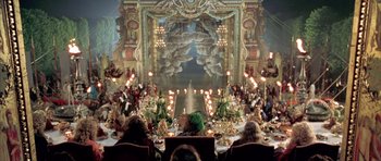 Movie still from “Vatel” (2000), directed by Roland Joffé – A group of people sitting at a table with candles; Extreme Wide shot, High angle