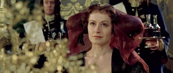 Movie still from “Vatel” (2000), directed by Roland Joffé – A person wearing a tiara; Close Up shot, Over the shoulder angle