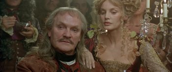 Movie still from “Vatel” (2000), directed by Roland Joffé – A man and a woman are posing for a picture; Close Up shot, Low angle