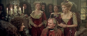 Movie still from “Vatel” (2000), directed by Roland Joffé – A group of people dressed in renaissance clothing; Medium shot, Over the shoulder angle