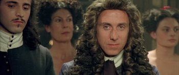Movie still from “Vatel” (2000), directed by Roland Joffé – A man in a wig and a woman in a dress suit; Close Up shot, Over the shoulder angle