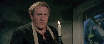 Movie still from “Vatel” (2000), directed by Roland Joffé – A man holding a candle in front of him; Close Up shot, Low angle