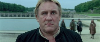 Movie still from “Vatel” (2000), directed by Roland Joffé – A person wearing a jacket; Close Up shot, Low angle