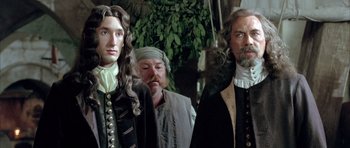 Movie still from “Vatel” (2000), directed by Roland Joffé – A group of men standing next to each other; Medium shot, Over the shoulder angle