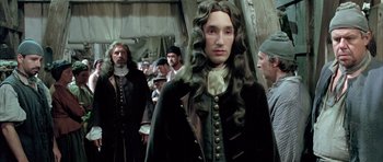 Movie still from “Vatel” (2000), directed by Roland Joffé – A group of people standing next to each other in a room; Medium shot, Over the shoulder angle