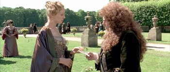 Movie still from “Vatel” (2000), directed by Roland Joffé – Two women in medieval garb are looking at each other; Medium shot, Over the shoulder angle