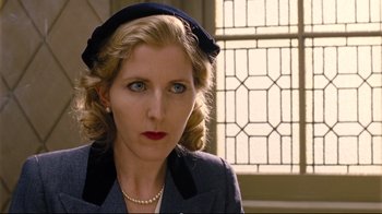 Movie still from “Vera Drake” (2004), directed by Mike Leigh – A woman wearing a hat and a necklace; Close Up shot, Low angle