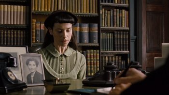 Movie still from “Vera Drake” (2004), directed by Mike Leigh – A woman sitting at a table in a library; Close Up shot, Over the shoulder angle