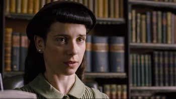 Movie still from “Vera Drake” (2004), directed by Mike Leigh – A woman in a library with a book case in the background; Close Up shot, Low angle