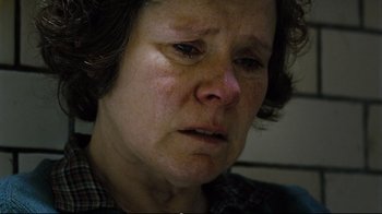 Movie still from “Vera Drake” (2004), directed by Mike Leigh – An older woman is crying with her eyes closed; Close Up shot, Low angle