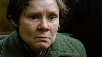 Movie still from “Vera Drake” (2004), directed by Mike Leigh – An older woman with blue eyes looking at the camera; Close Up shot, Low angle