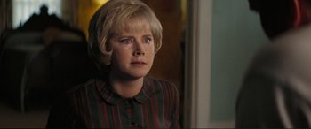 Movie still from “Vice” (2018), directed by Adam McKay – A woman with blonde hair sitting in front of a window; Close Up shot, Over the shoulder angle