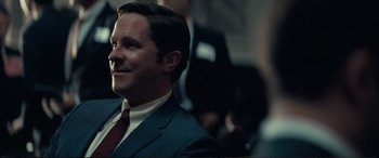 Movie still from “Vice” (2018), directed by Adam McKay – A person wearing a suit and tie; Close Up shot, Over the shoulder angle