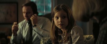 Movie still from “Vice” (2018), directed by Adam McKay – A young girl sitting in front of an older man; Close Up shot, Over the shoulder angle