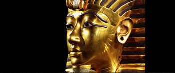 Movie still from “Vice” (2018), directed by Adam McKay – A gold statue of a man with a golden crown; Extreme Close Up shot, Low angle