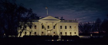 Movie still from “Vice” (2018), directed by Adam McKay – The white house is lit up at night time; Extreme Wide shot, Low angle