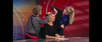 Movie still from “Vice” (2018), directed by Adam McKay – Two women and a woman sitting at a desk; Medium shot, Over the shoulder angle