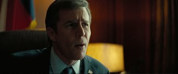 Movie still from “Vice” (2018), directed by Adam McKay – A person wearing a suit and tie; Close Up shot, Over the shoulder angle