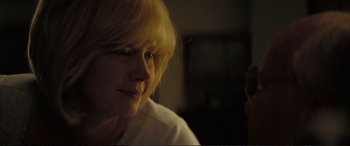 Movie still from “Vice” (2018), directed by Adam McKay – A woman with blonde hair looking into a mirror; Close Up shot, Over the shoulder angle