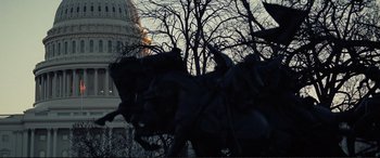 Movie still from “Vice” (2018), directed by Adam McKay – A statue of a man riding a horse in front of the capitol building; Extreme Wide shot, Low angle