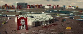 Movie still from “Vice” (2018), directed by Adam McKay – A model of the pentagon is displayed on a table; Extreme Wide shot, High angle