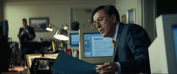 Movie still from “Vice” (2018), directed by Adam McKay – A man sitting at a desk in front of a computer; Close Up shot, Over the shoulder angle
