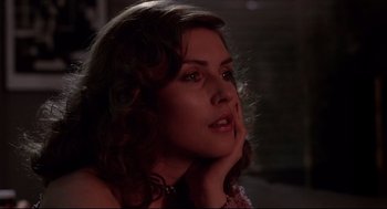 Movie still from “Videodrome” (1983), directed by David Cronenberg – A beautiful woman sitting in front of a window; Close Up shot, Low angle