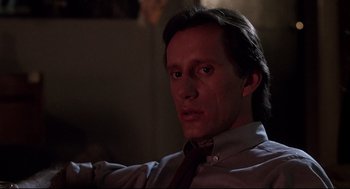 Movie still from “Videodrome” (1983), directed by David Cronenberg – A person wearing a shirt and a tie; Close Up shot, Low angle