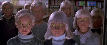 Movie still from “Village of the Damned” (1995), directed by John Carpenter – A group of kids with green eyes and blonde hair; Close Up shot, High angle