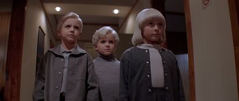 Movie still from “Village of the Damned” (1995), directed by John Carpenter – A group of young people standing next to each other; Medium shot, Low angle