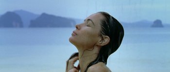 Movie still from “Vinyan” (2008), directed by Fabrice du Welz – A woman with her eyes closed with her hair hanging in the air; Close Up shot, Low angle
