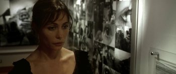 Movie still from “Vinyan” (2008), directed by Fabrice du Welz – A person in front of a wall; Close Up shot, Over the shoulder angle