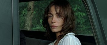 Movie still from “Vinyan” (2008), directed by Fabrice du Welz – A person sitting in a car; Close Up shot, Over the shoulder angle