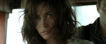 Movie still from “Vinyan” (2008), directed by Fabrice du Welz – A person with blue eyes; Close Up shot, Low angle