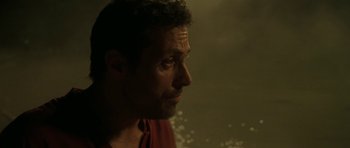 Movie still from “Vinyan” (2008), directed by Fabrice du Welz – A person looking out of a window; Close Up shot, Over the shoulder angle