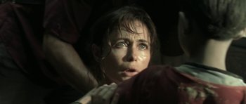 Movie still from “Vinyan” (2008), directed by Fabrice du Welz – A person with wet hair and blue eyes; Close Up shot, Over the shoulder angle