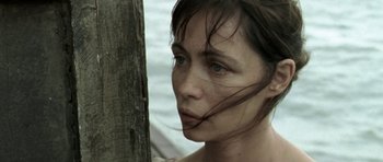 Movie still from “Vinyan” (2008), directed by Fabrice du Welz – A person with a tree in the background; Close Up shot, Over the shoulder angle