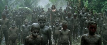 Movie still from “Vinyan” (2008), directed by Fabrice du Welz – A group of people walking through the jungle; Wide shot, High angle