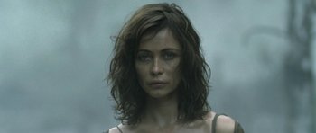 Movie still from “Vinyan” (2008), directed by Fabrice du Welz – A person wearing a shirt; Close Up shot, Low angle