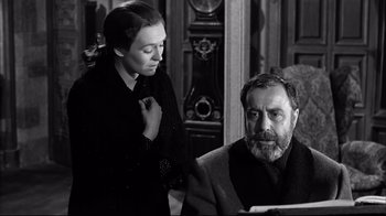 Movie still from “Viridiana” (1961), directed by Luis Buñuel – An older man sitting next to a younger woman; Close Up shot, Low angle