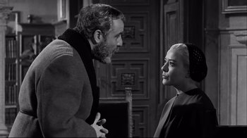 Movie still from “Viridiana” (1961), directed by Luis Buñuel – A man and a woman talking to each other; Medium shot, Over the shoulder angle