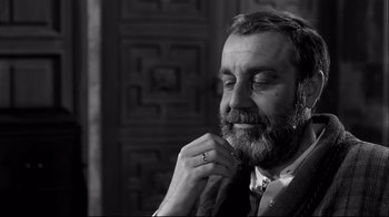 Movie still from “Viridiana” (1961), directed by Luis Buñuel – Black and white photograph of a man with a beard; Close Up shot, Low angle