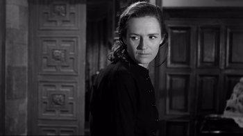 Movie still from “Viridiana” (1961), directed by Luis Buñuel – A black and white photo of a woman in a room; Close Up shot, Low angle
