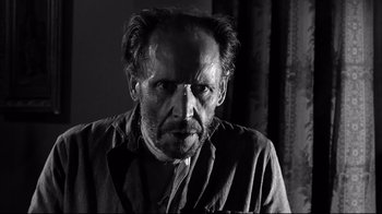 Movie still from “Viridiana” (1961), directed by Luis Buñuel – A black and white photo of a man with a beard; Close Up shot, Low angle