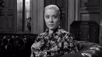 Movie still from “Viridiana” (1961), directed by Luis Buñuel – A black and white photo of a woman holding a tea cup; Close Up shot, High angle