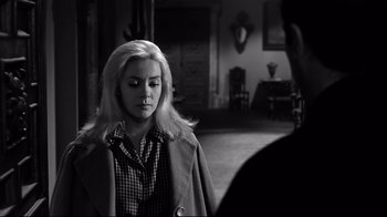 Movie still from “Viridiana” (1961), directed by Luis Buñuel – A black and white photo of a woman in a room; Medium shot, Over the shoulder angle