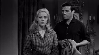 Movie still from “Viridiana” (1961), directed by Luis Buñuel – A man and a woman standing next to each other; Medium shot, Low angle