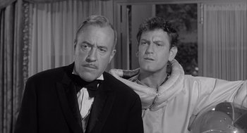 Movie still from “Visit to a Small Planet” (1960), directed by Norman Taurog – A man and a woman standing next to each other in a room; Close Up shot, Low angle