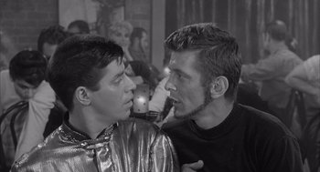 Movie still from “Visit to a Small Planet” (1960), directed by Norman Taurog – Two young men are talking to each other; Close Up shot, Over the shoulder angle